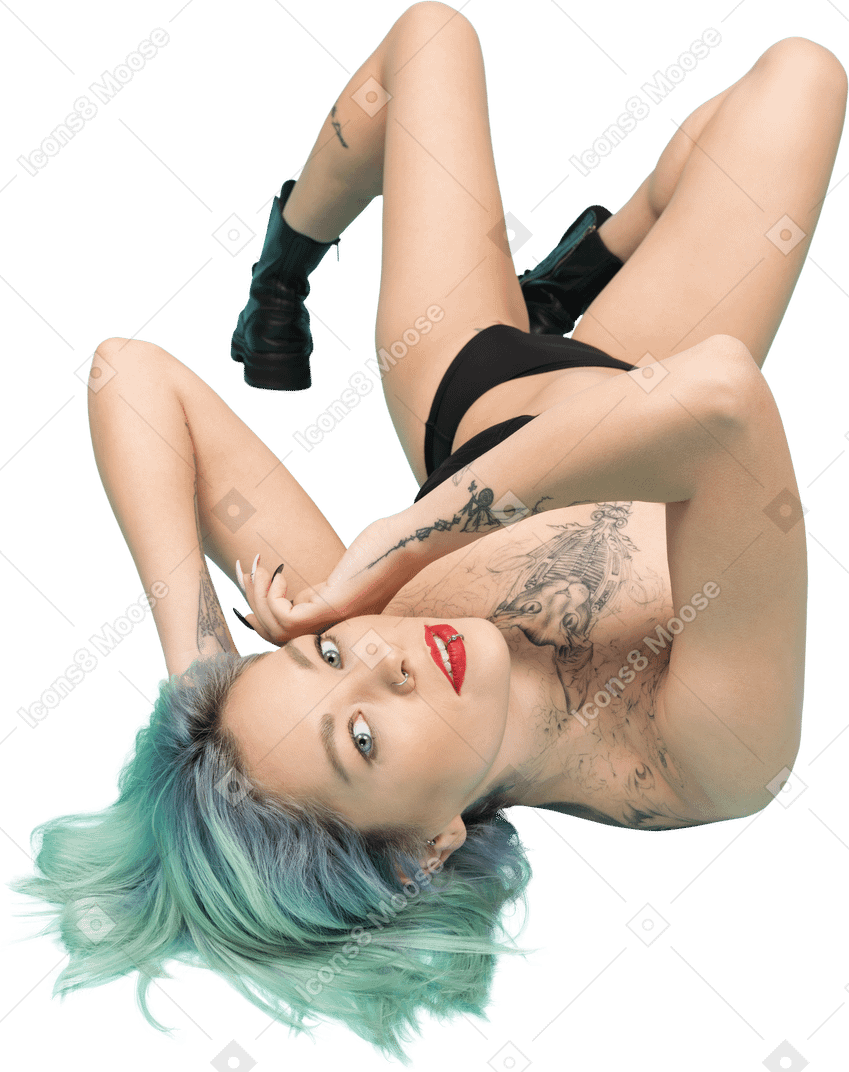 Sexy female in black lingerie posing on the floor