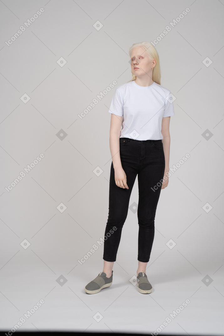 Girl standing and lookind aside