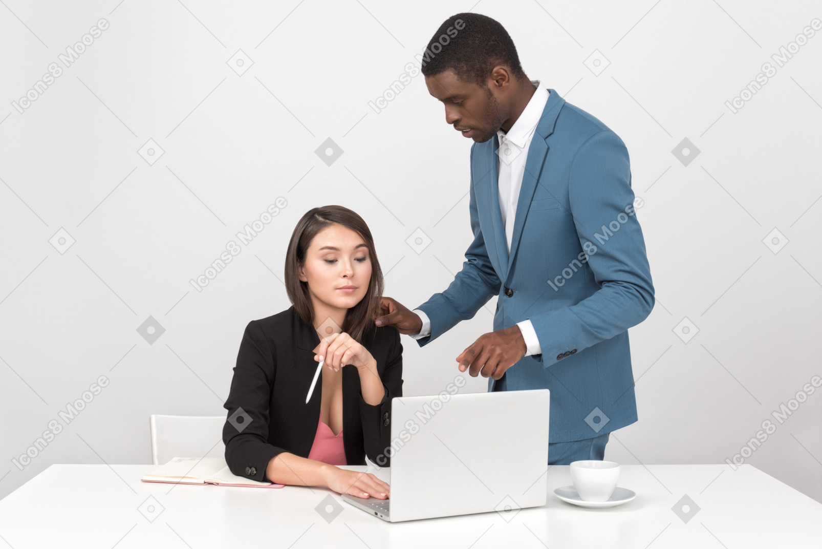 Man explaining some work stuff to female colleague