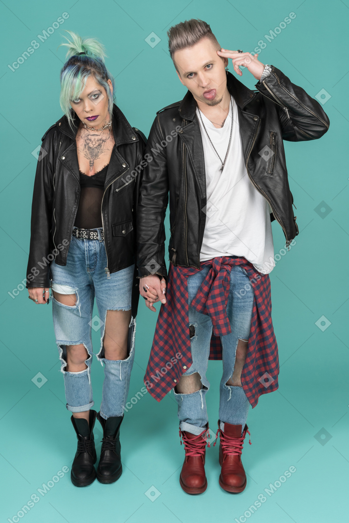 Two punks standing against camera and gesturing