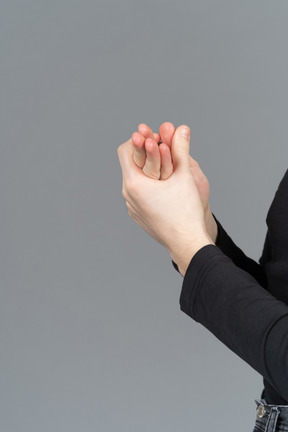 Side view of hands being sanitized