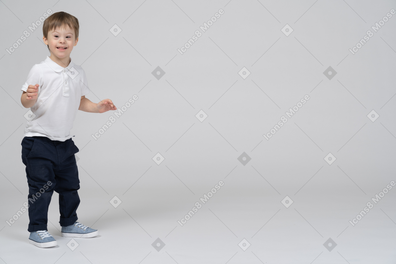 Excited little boy with raised arms