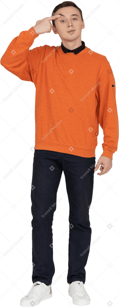 Young man in orange sweatshirt standing