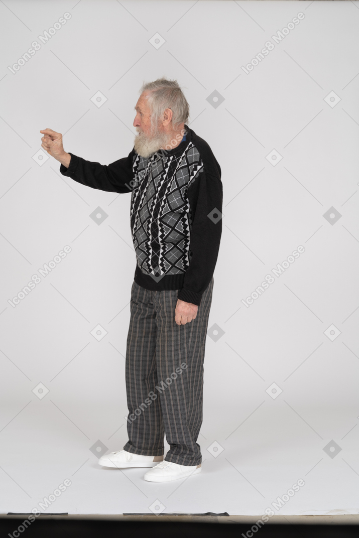 Side view of old man showing little gesture