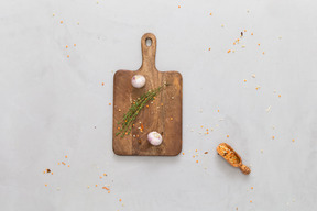 Cutting boards with some ingredients and a bowl of sauce