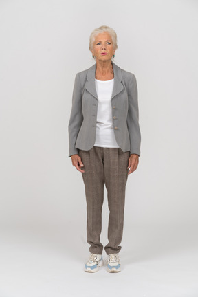 Front view of an old lady in suit