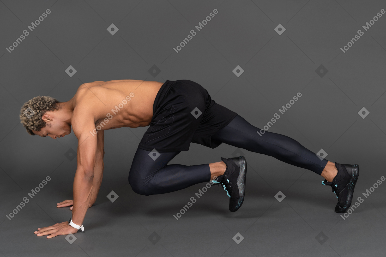 Side view of a shirtless afro man making plank and raising leg