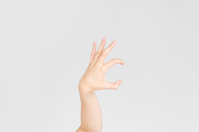 Female hand showing kind of scary gesture