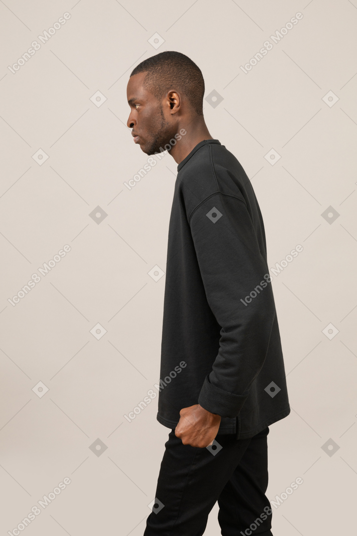 Side view of man with clenched fist