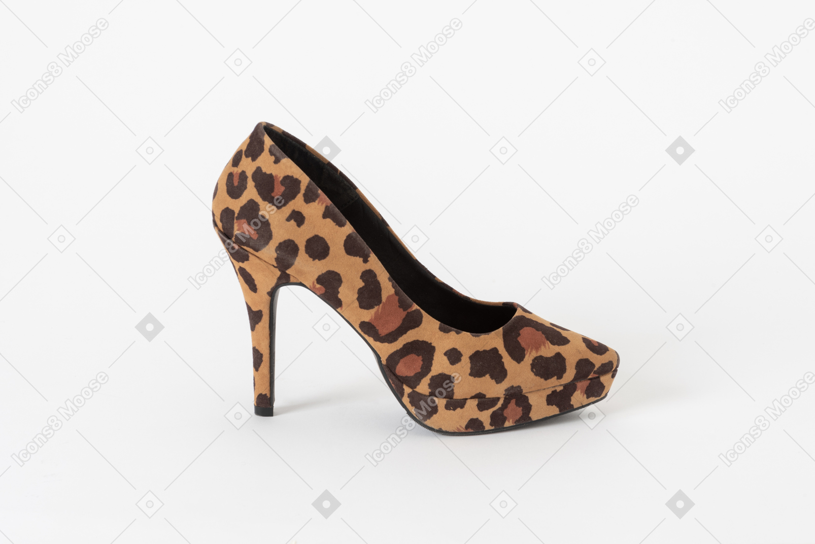 A side shot of a stiletto shoe with a leopard print on