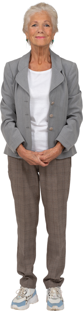 Front view of an old lady in suit smiling and looking at camera
