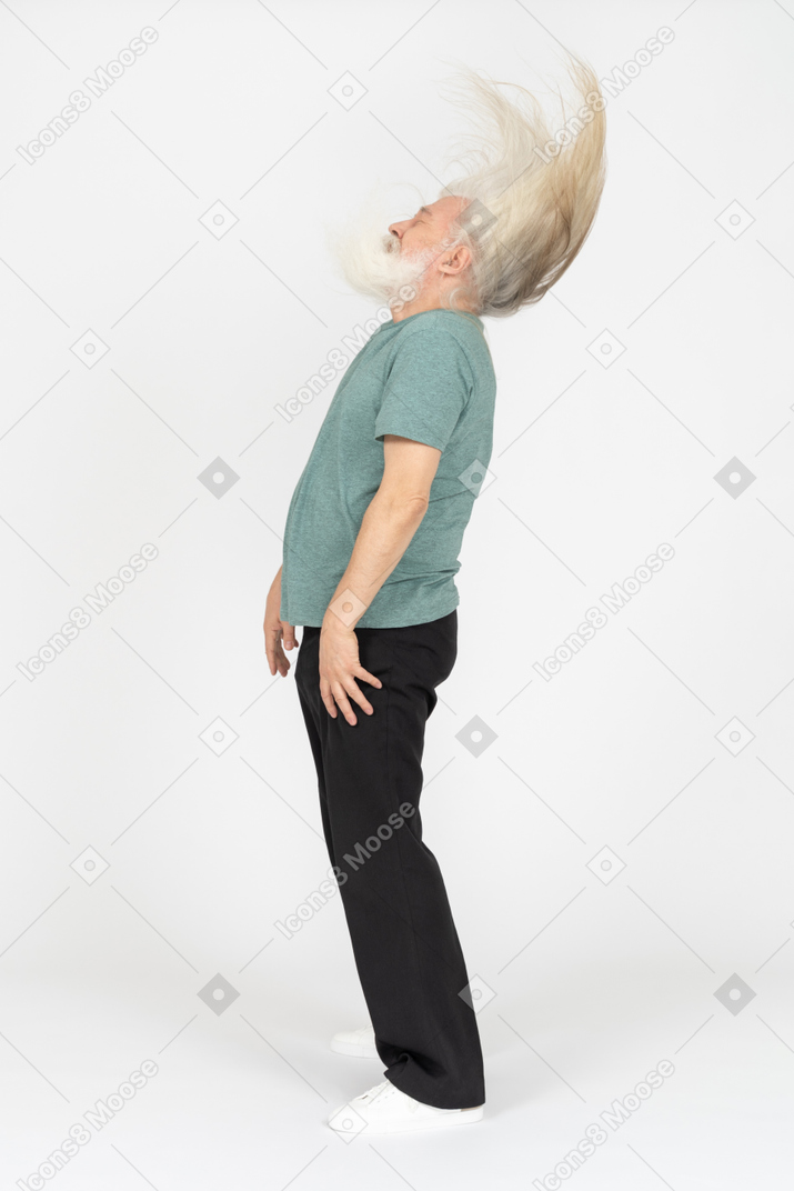 Side view of old man shaking head