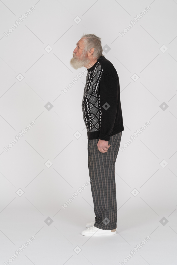 Side view of an elderly man standing