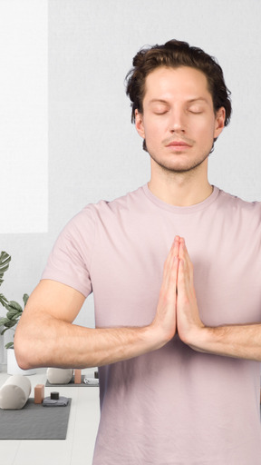 A man meditating in a yoga studio