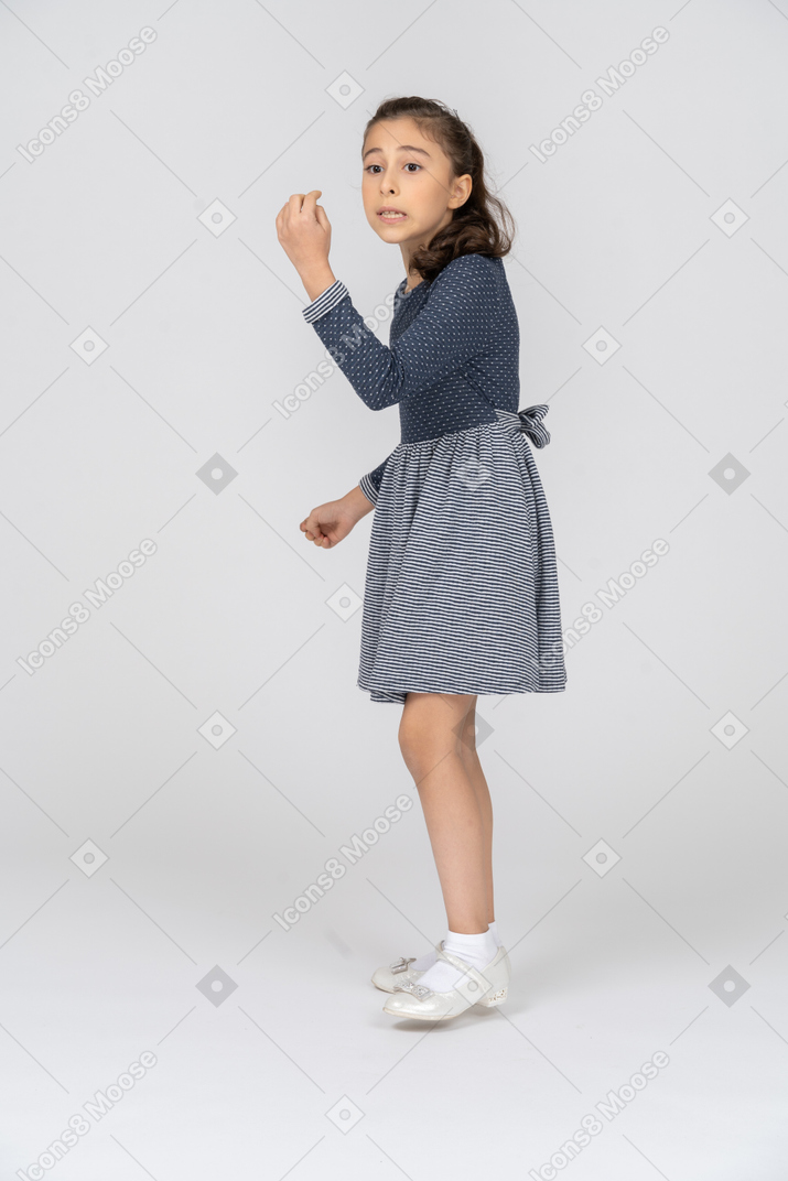 Side view of a girl explaining something eagerly