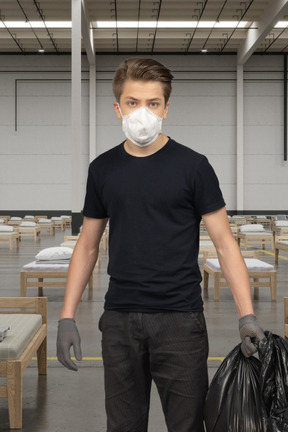 Young man working at a covid hospital