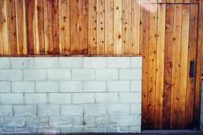 A white brick wall and a wooden wall