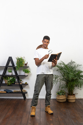 Good looking young man with a book