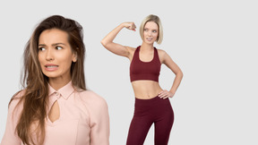 Nervous woman in pink dress and athletic woman in red gym set