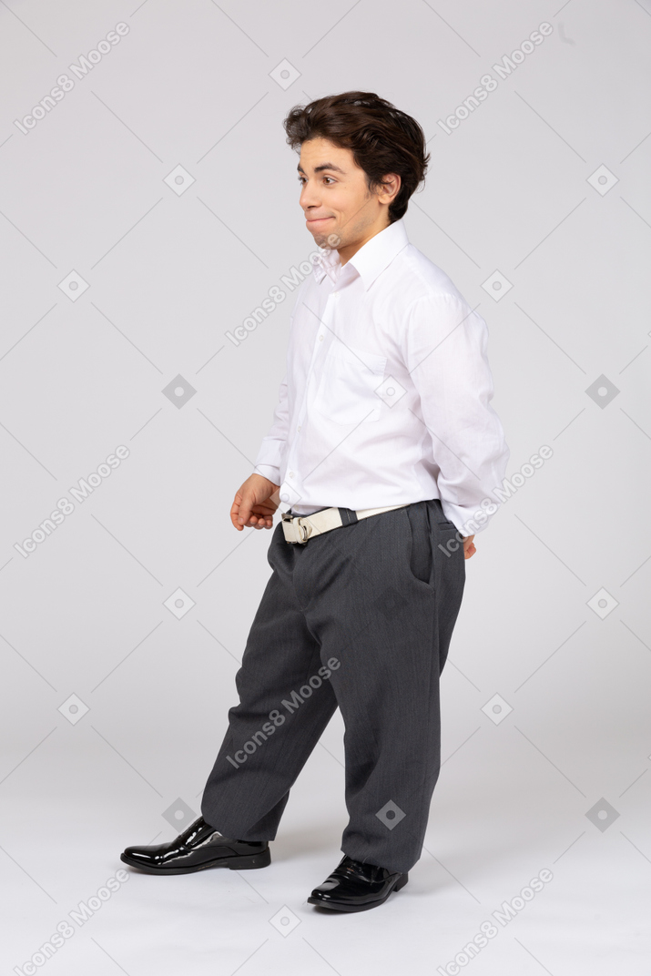 Smiling young man stands