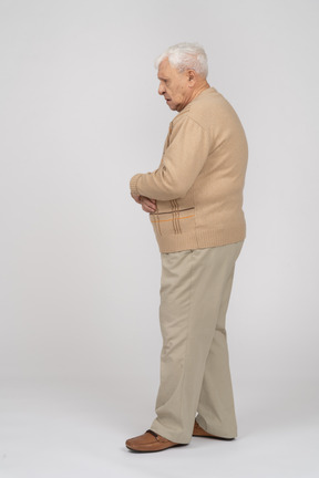 Side view of an old man in casual clothes