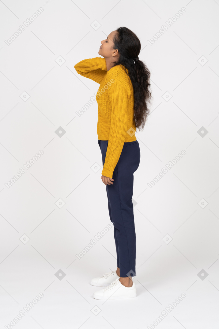 Side view of a girl in casual clothes suffering from pain in neck