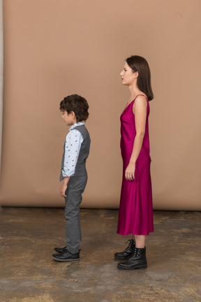 Woman and kid standing in profile