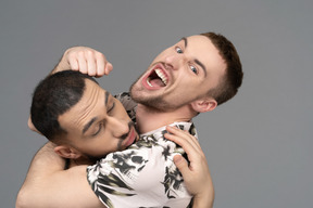 Close-up of two young caucasian men fooling around