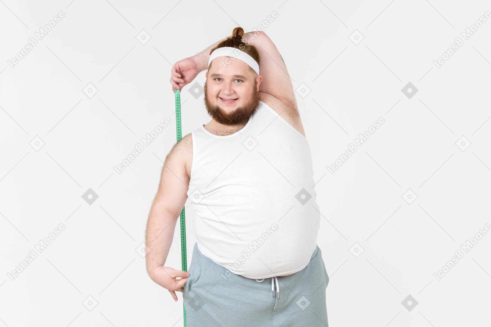 Young big guy in sportswear measuring himself with cloth ruler
