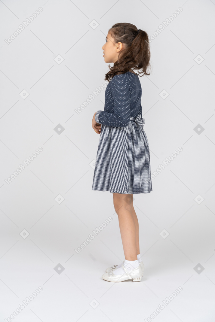 Side view of a girl looking lost in thought