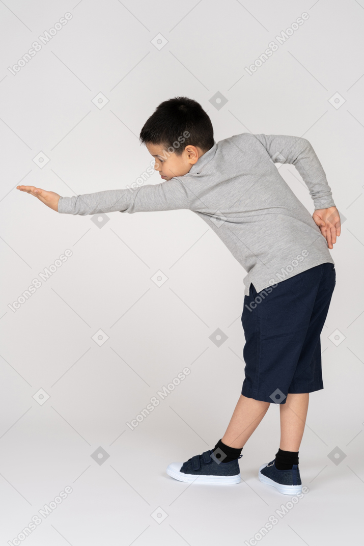 Boy stretching hand