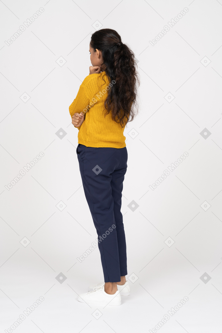 Side view of a thoughtful girl in casual clothes