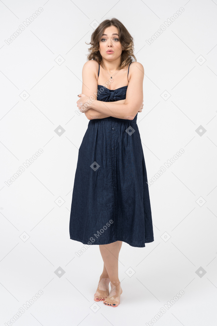 Cute young woman feeling cold and shivering
