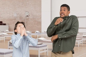 Scared man and sneezing boy