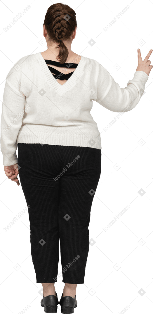 Plump woman in casual clothes showing peace sign