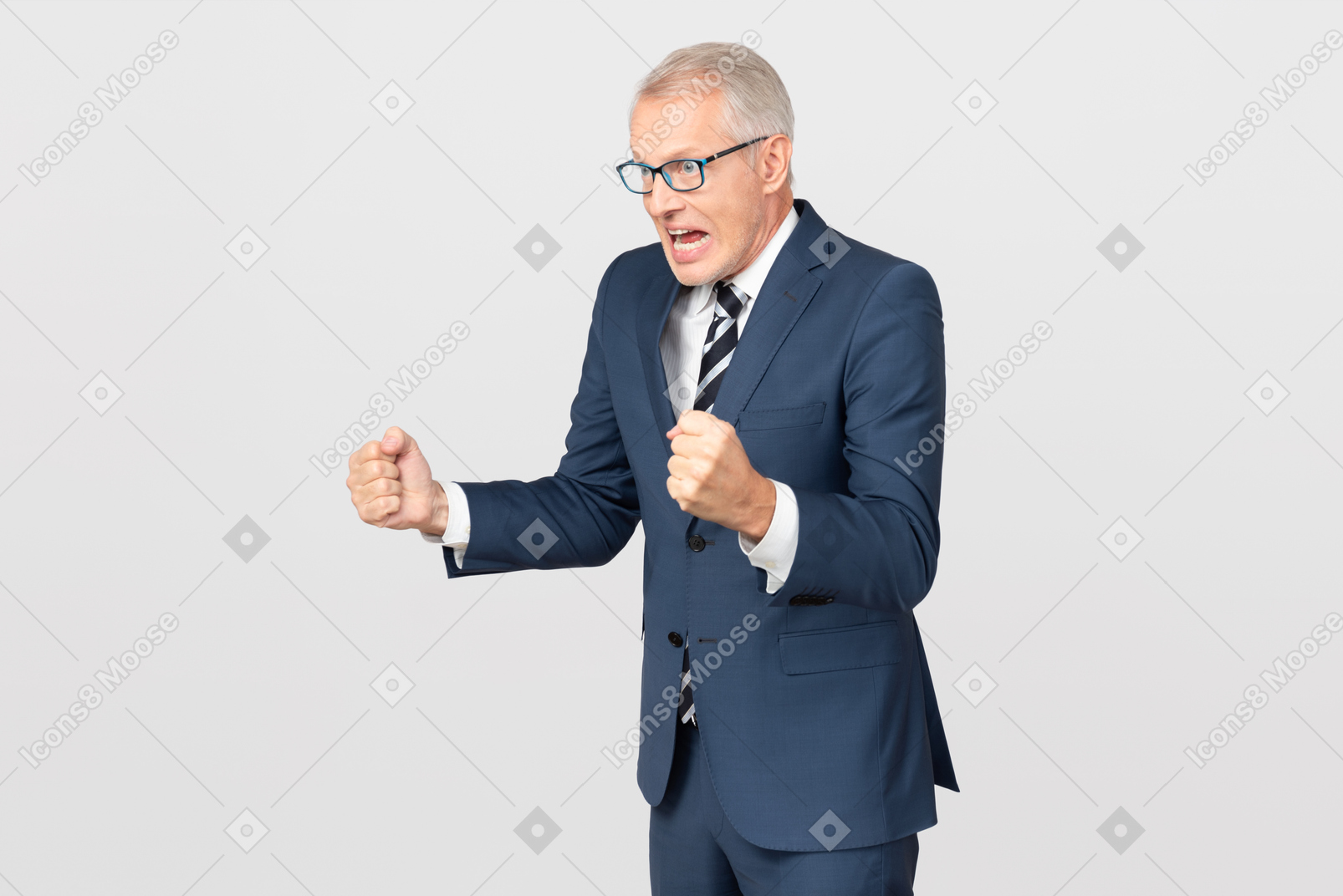 Angry mature businessman holding clenched fists up