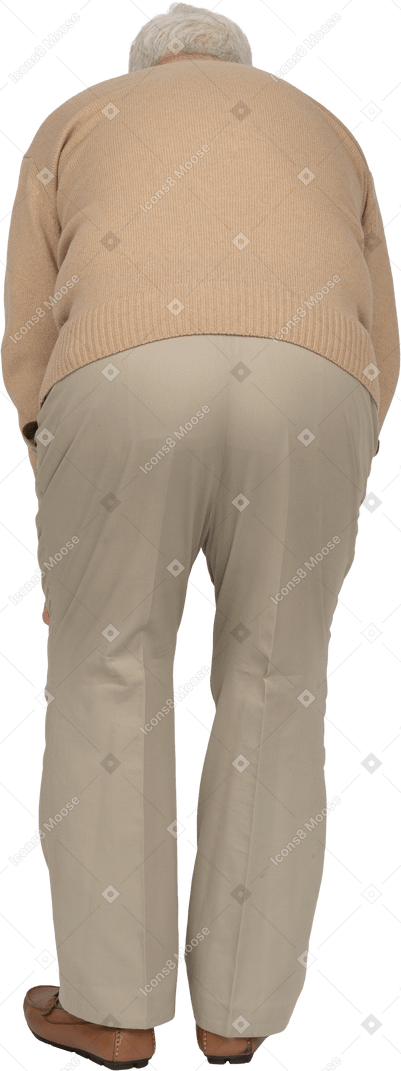 Rear view of an old man in casual clothes bending down