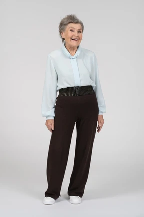Front view of an old woman smiling and winking with her right eye