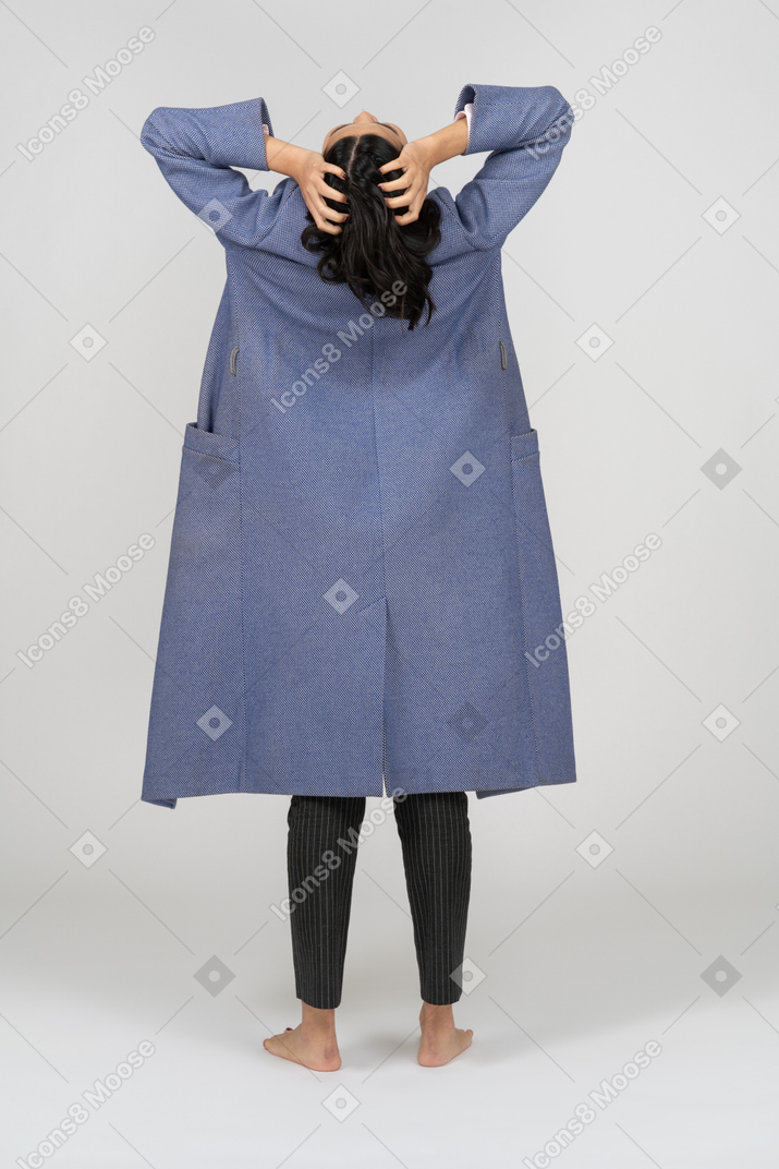 Rear view of a stressed woman throwing head back