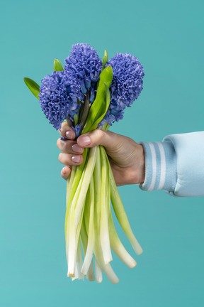 Holding flowers in hand