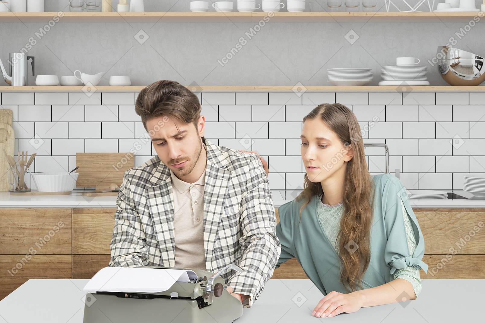 A man and woman sitting at a table looking at a typewriter