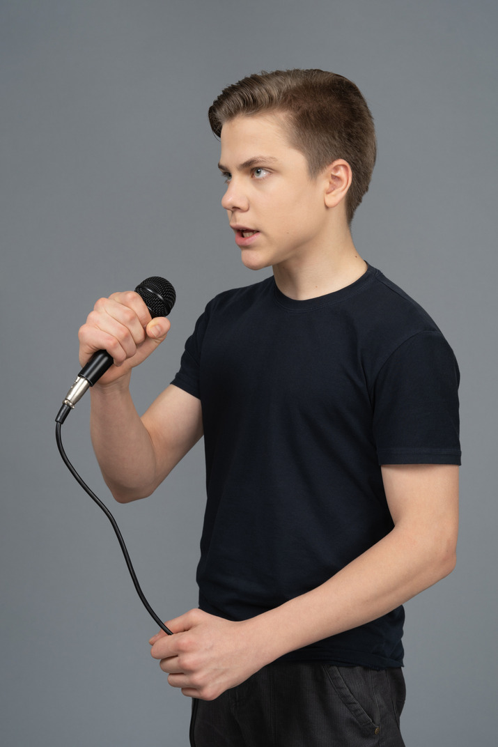 Young man speaking into microphone