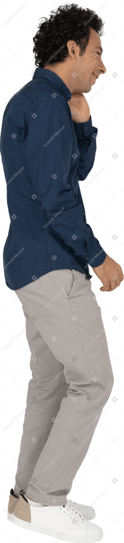Happy man in casual clothes posing in profile