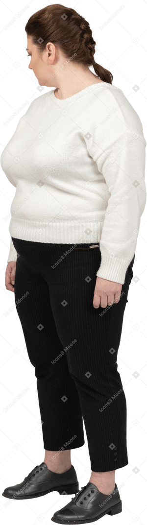 Plump woman in casual clothes standing