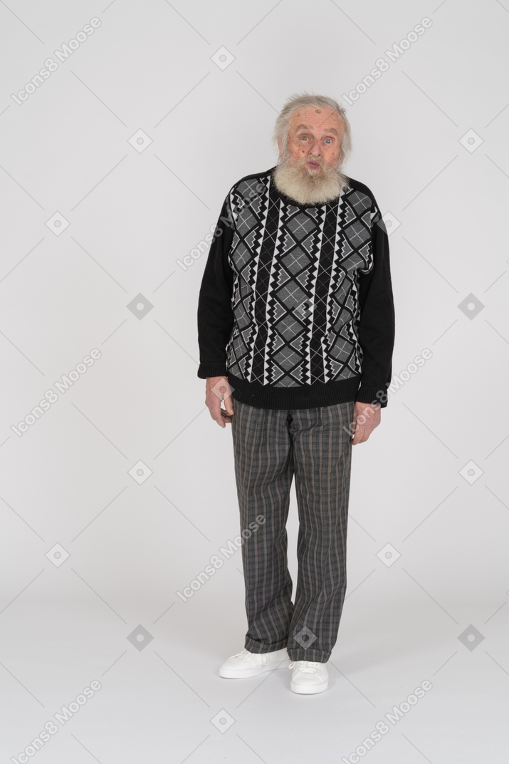 Front view of an old man standing with duck face