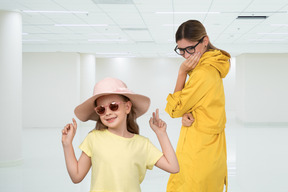 A woman in a yellow dress and a little girl in a yellow dress