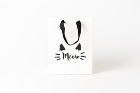 Cute little paper gift bag with black hands