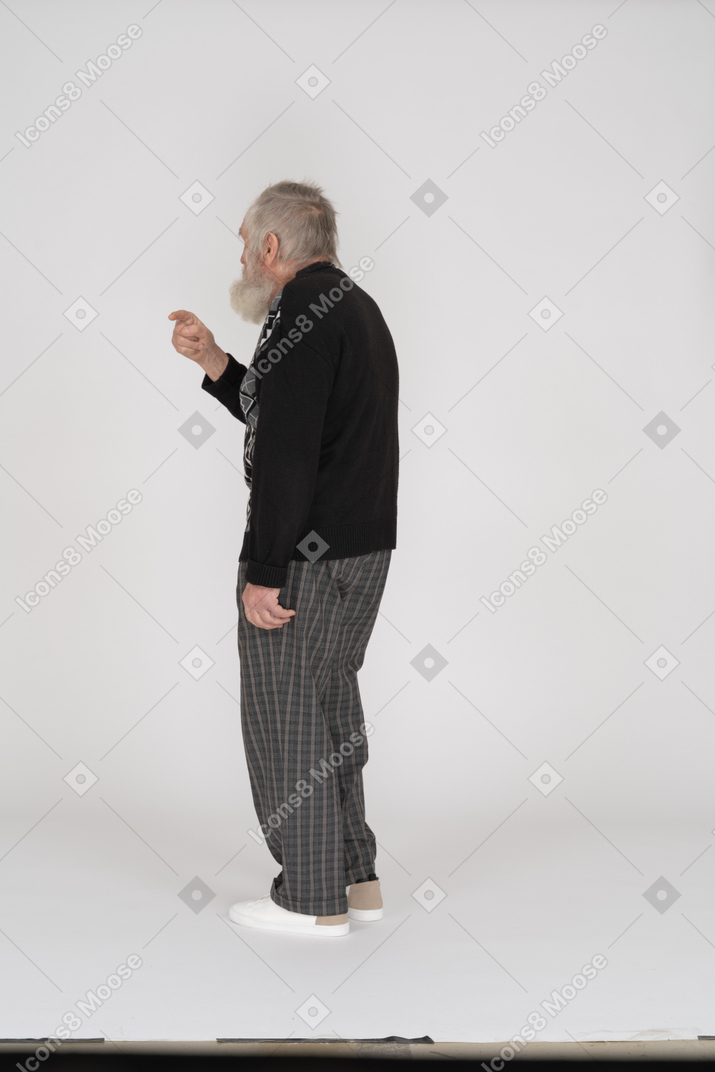 Back view of old man with raised arm