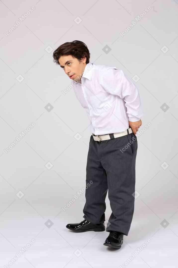 Man pulling up trousers