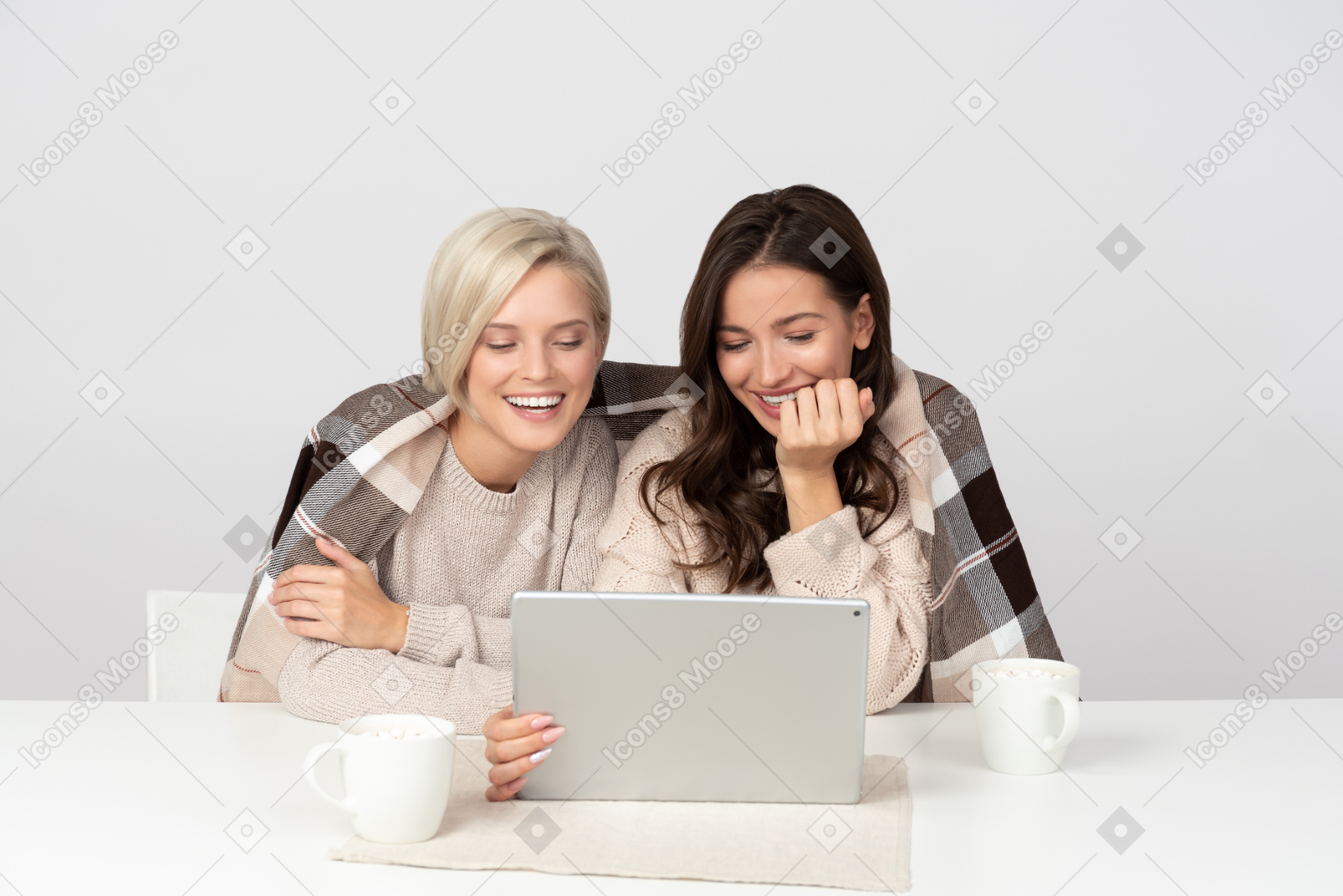 Young women watching movies and laughing